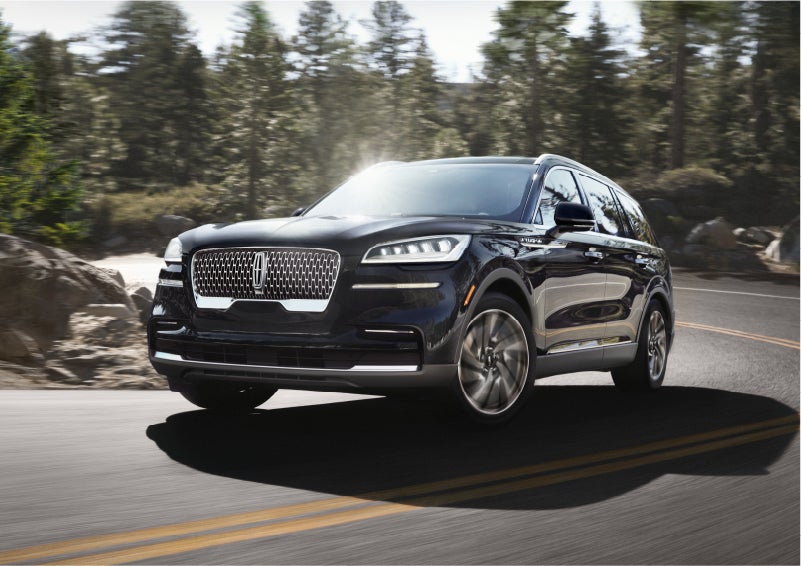 A Lincoln Aviator® SUV is being driven on a winding mountain road | Spitzer Lincoln DuBois in Du Bois PA