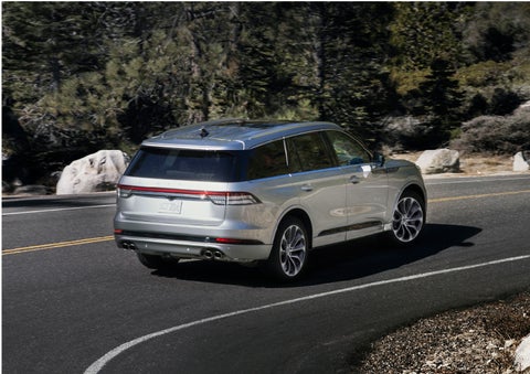 A Lincoln Aviator® is being driven on a winding road | Spitzer Lincoln DuBois in Du Bois PA