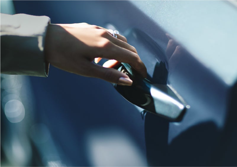A hand gracefully grips the Light Touch Handle of a 2023 Lincoln Aviator® SUV to demonstrate its ease of use | Spitzer Lincoln DuBois in Du Bois PA