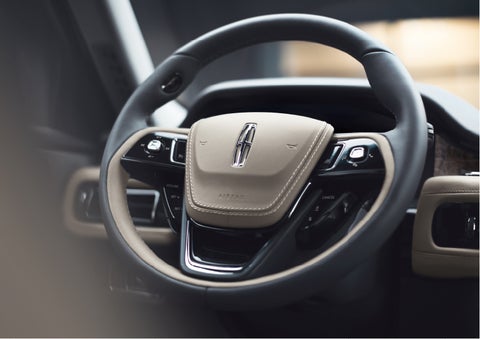 The intuitively placed controls of the steering wheel on a 2023 Lincoln Aviator® SUV | Spitzer Lincoln DuBois in Du Bois PA