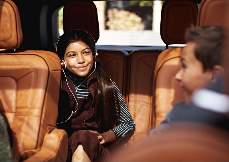 Two young people are comfortably seated in the second and third rows of a Lincoln Aviator® SUV | Spitzer Lincoln DuBois in Du Bois PA