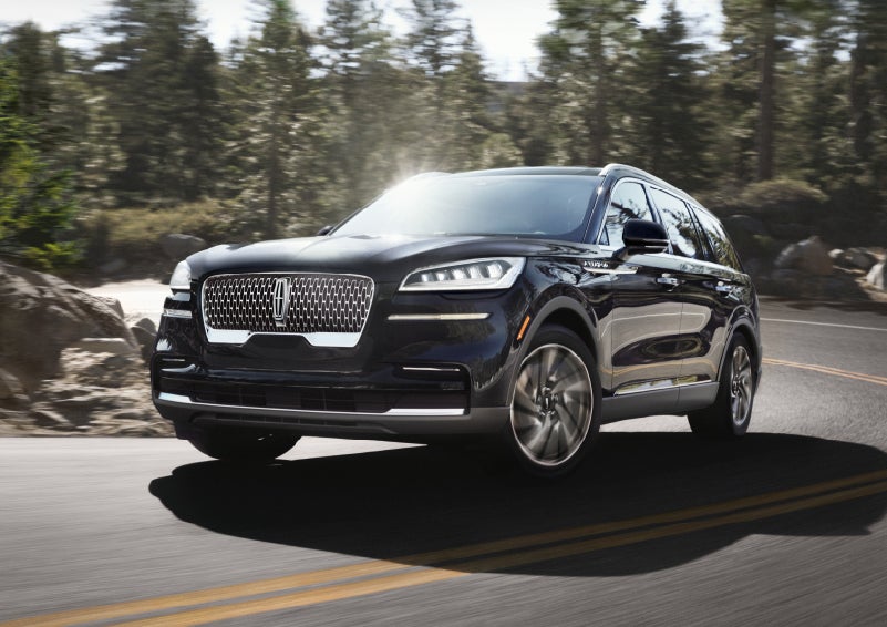 A Lincoln Aviator® SUV is being driven on a winding mountain road | Spitzer Lincoln DuBois in Du Bois PA