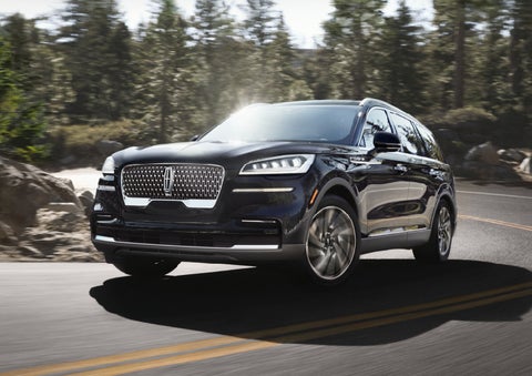 A Lincoln Aviator® SUV is being driven on a winding mountain road | Spitzer Lincoln DuBois in Du Bois PA