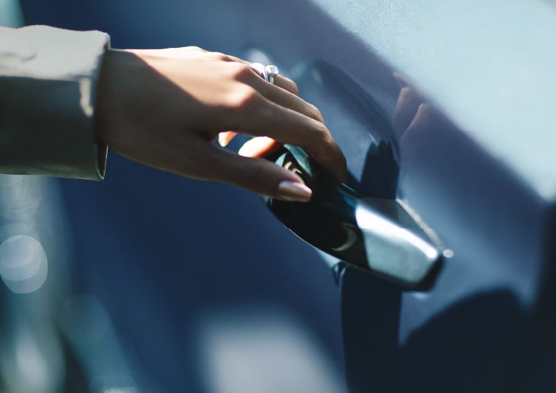 A hand gracefully grips the Light Touch Handle of a 2024 Lincoln Aviator® SUV to demonstrate its ease of use | Spitzer Lincoln DuBois in Du Bois PA