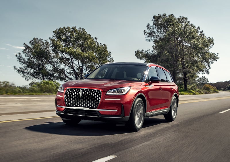 A 2024 Lincoln Corsair® SUV is shown being driven on a country road. | Spitzer Lincoln DuBois in Du Bois PA