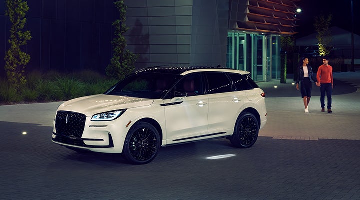 Two people approach a 2024 Lincoln Corsair® SUV featuring the available Jet Appearance Package. | Spitzer Lincoln DuBois in Du Bois PA