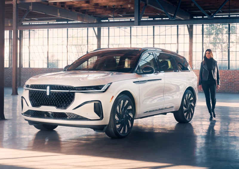 A person approaches a 2024 Lincoln Nautilus® SUV. | Spitzer Lincoln DuBois in Du Bois PA