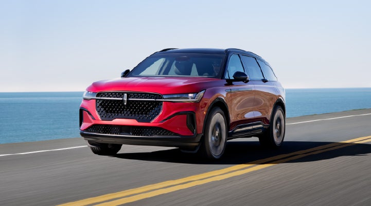 A 2025 Lincoln Nautilus® SUV is being driven on a seaside roadway. | Spitzer Lincoln DuBois in Du Bois PA