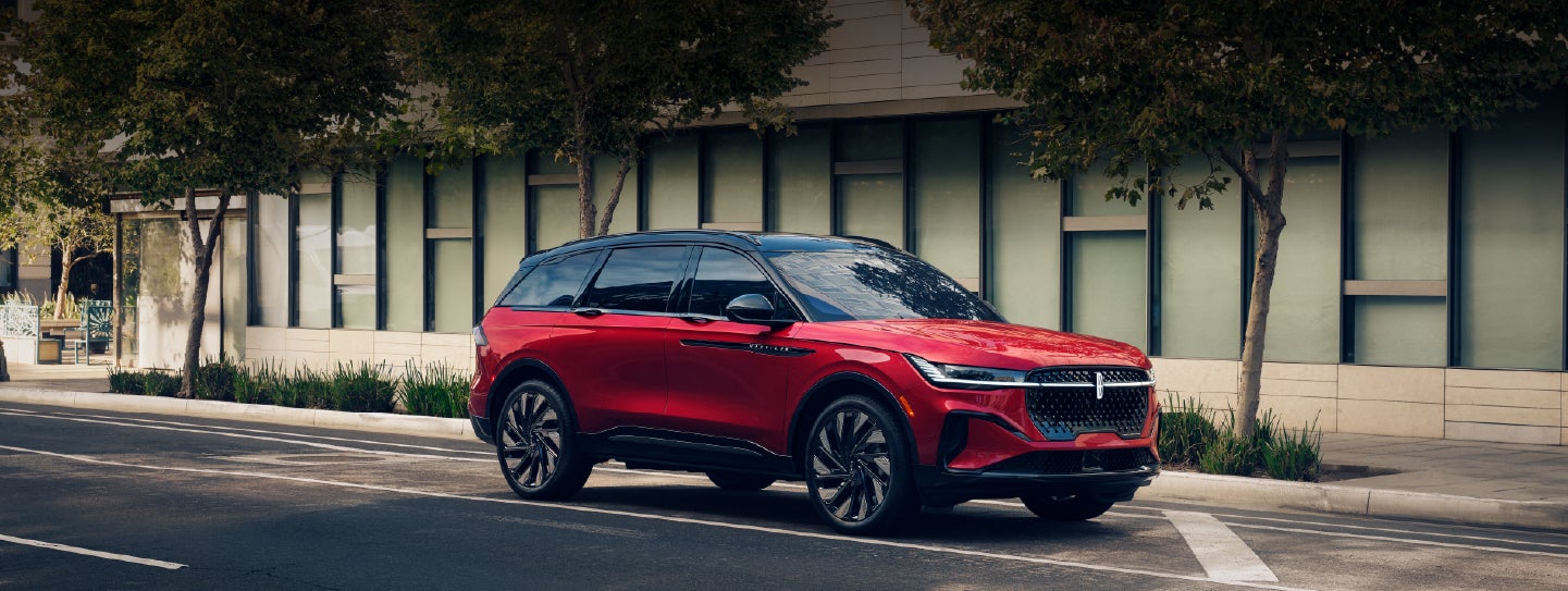 A 2025 Lincoln Nautilus® SUV with an available hybrid powertrain is parked in an urban setting. | Spitzer Lincoln DuBois in Du Bois PA