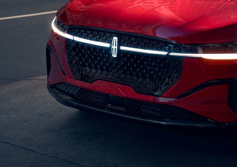 The available front LED light bar and center Lincoln Star logo glow at dusk. | Spitzer Lincoln DuBois in Du Bois PA