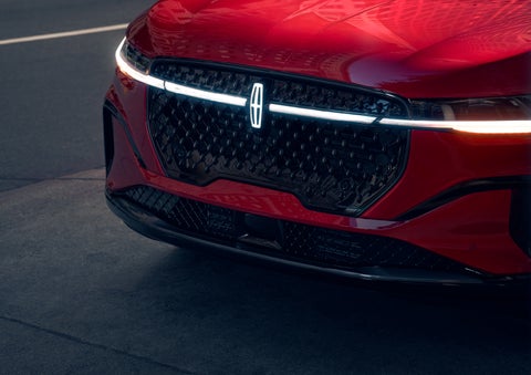 The available front LED light bar and center Lincoln Star logo glow at dusk. | Spitzer Lincoln DuBois in Du Bois PA