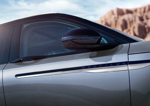 Blue lettering on the side of the vehicle that reads nautilus indicates the available hybrid powertrain. | Spitzer Lincoln DuBois in Du Bois PA