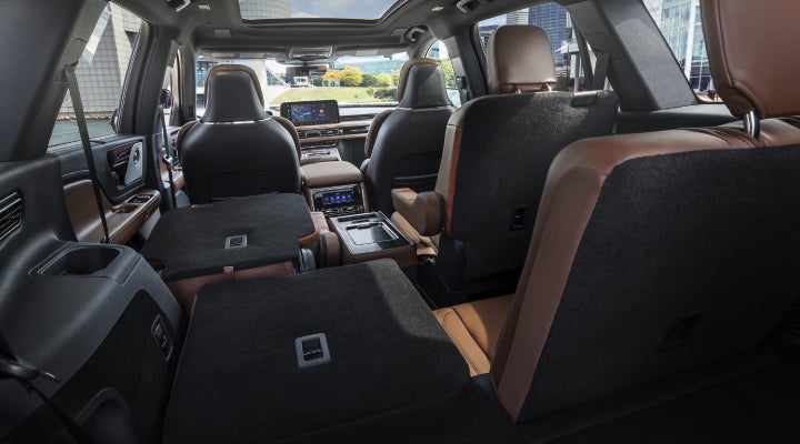 One side of the PowerFold® third-row seat and a second-row seat are folded forward in the 2026 Lincoln Aviator® SUV. | Spitzer Lincoln DuBois in Du Bois PA