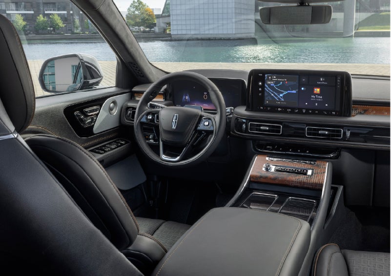 The interior of the 2026 Lincoln Aviator® SUV is shown parked with a view of a harbor through the windshield. | Spitzer Lincoln DuBois in Du Bois PA