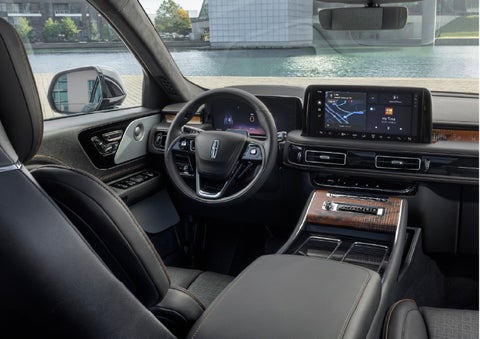 The interior of the 2026 Lincoln Aviator® SUV is shown parked with a view of a harbor through the windshield. | Spitzer Lincoln DuBois in Du Bois PA