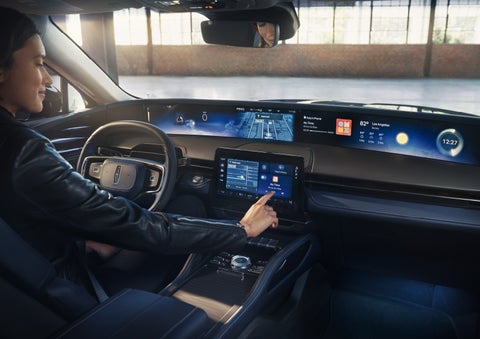 The driver of a 2026 Lincoln Nautilus® SUV interacts with the center touchscreen. | Spitzer Lincoln DuBois in Du Bois PA