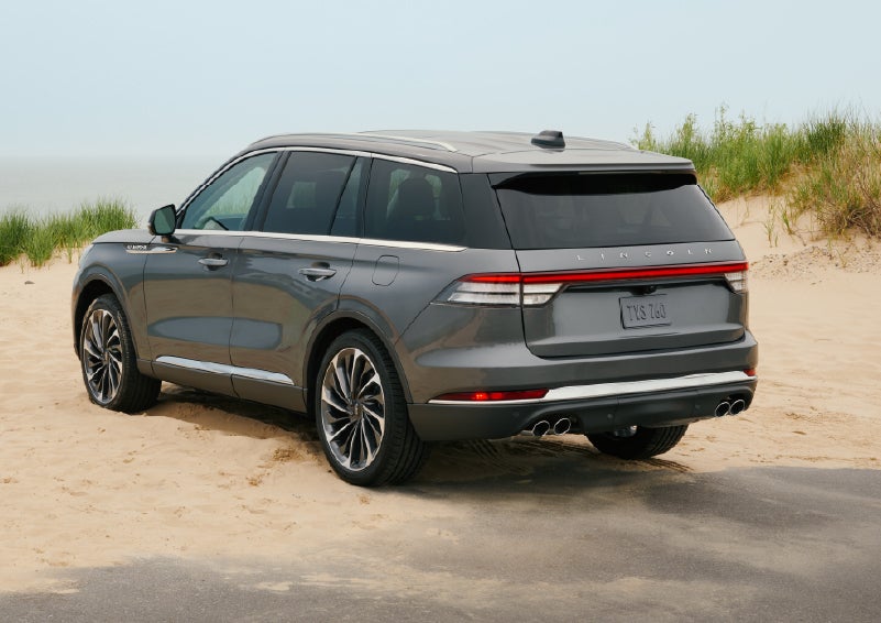 A 2027 Lincoln Aviator® SUV is parked next to sand dunes. | Spitzer Lincoln DuBois in Du Bois PA