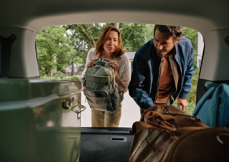 A couple loads luggage into the rear of a 2027 Lincoln Aviator® Black Label™ SUV..e 202 | Spitzer Lincoln DuBois in Du Bois PA